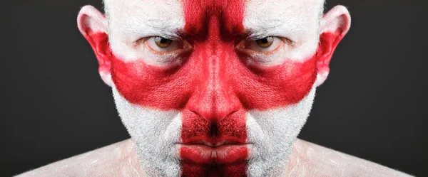 Homem com o rosto pintado com a bandeira da Inglaterra . — Fotografia de Stock