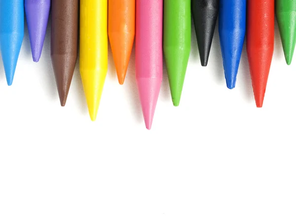 A stack of colorful crayons isolated on white background. — Stock Photo, Image