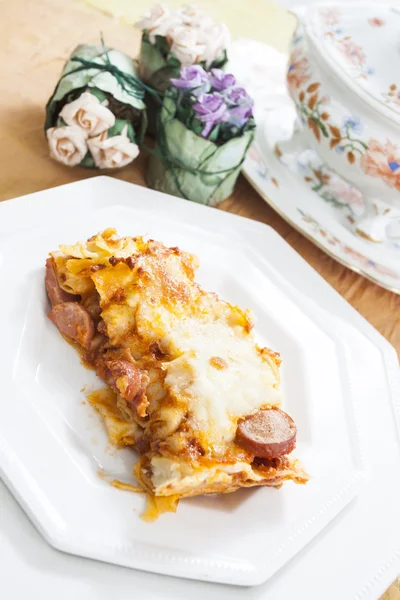 Lasagne with minced meat and sausages — Stock Photo, Image