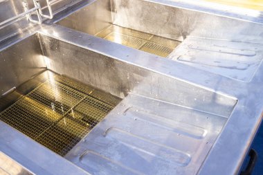 oil fryers ready to be used at a summer fair in Muggia, Italy