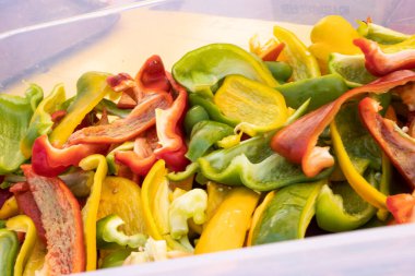 Preparation of grilled peppers during the Summer Carnival in Muggia, Trieste, Italy
