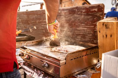 Piadina with ham on the grill, Muggia, Trieste, Italy