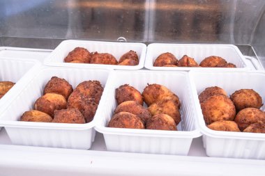 Pancakes in white plastic bowls