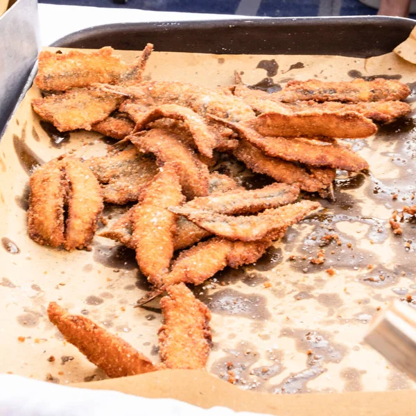 Typical recipe preparation of anchovy breaded in Muggia, Trieste, Italy