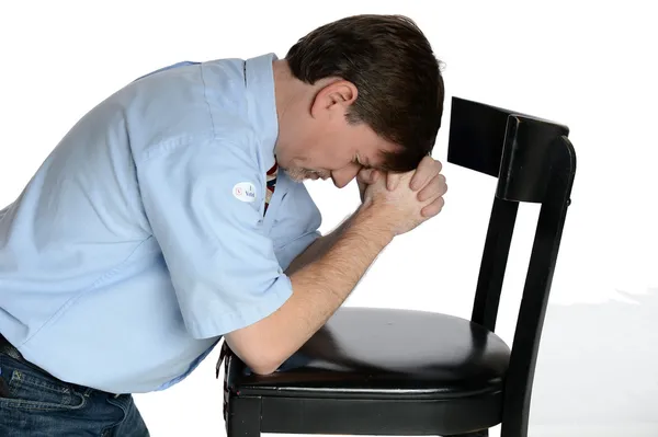 Kneeling man prays — Stock Photo, Image