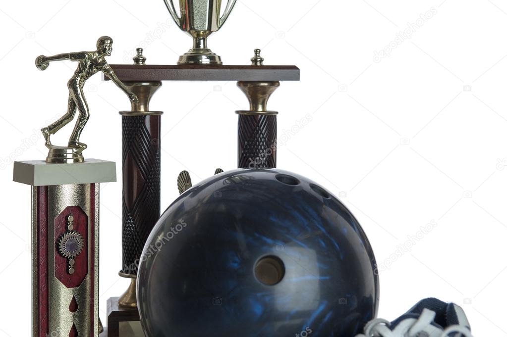 Bowling ball, shoes and tropies