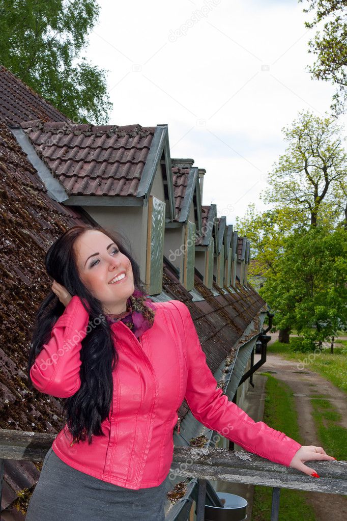 A girl standing on the balcony