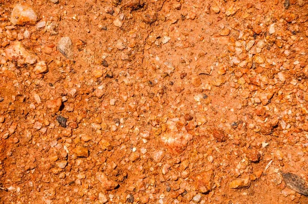 Πηλό Έδαφος Κοκκινωπό Μικρές Πέτρες Πλήρες Πλαίσιο — Φωτογραφία Αρχείου