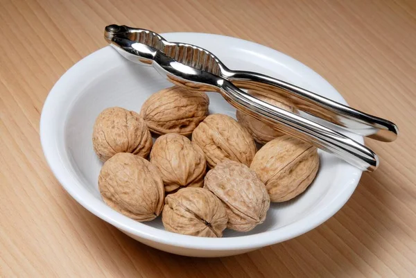 Bowl Walnuts Nutcracker Standing Wooden Table — 图库照片