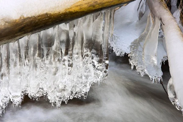 Icicles Hanging Wooden Stick Creek — Stockfoto