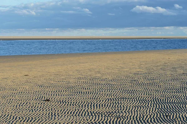 Ripple patterns in front of a tidal creek on the western beach of Spiekeroog, East Frisia, Lower Saxony, Germany, Europe