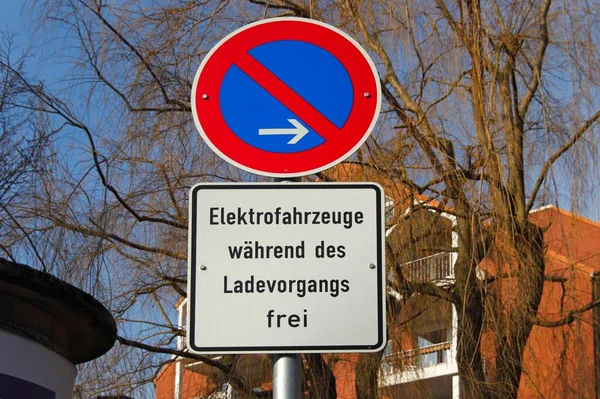 Traffic sign stopping permission for electric cars during charging, electric charging station, restricted stopping, electric charging, Wedel, Schleswig-Holstein, Germany, Europe