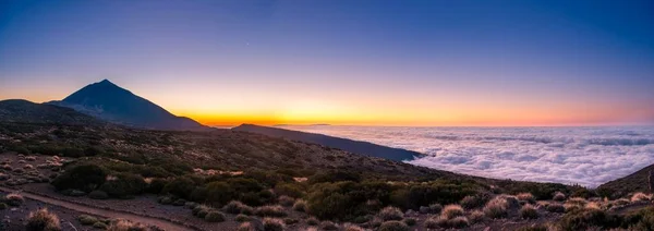 Sunset, sunset glow with evening star, cloudy sky, Volcano Teide and volcano landscape, backlit scenery, national park El Teide, Tenerife, Canary Islands, Spain, Europe