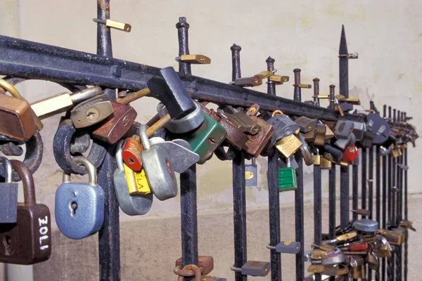 Padlocks as signs of love on a fence in Pecs Hungary