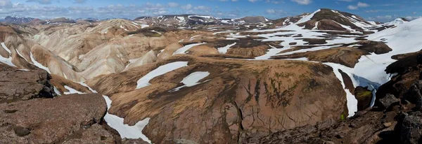 Brown volcanic landscape with snow-capped mountains and volcanoes, panoramic view, Landmannalaugar, Iceland, Europe