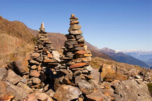 Stone man as track marker at Stubai Valley, Tyrol, Austria, Europe