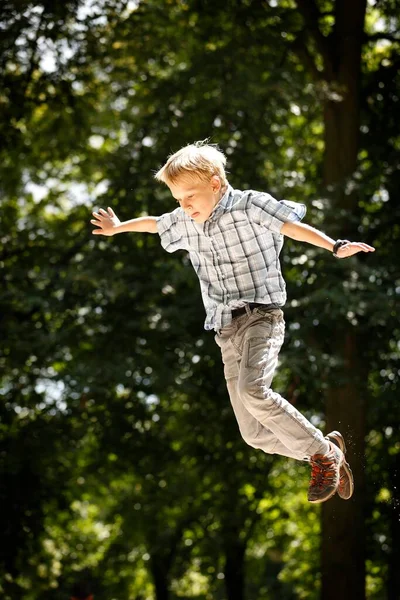 Boy Years Playground Jumping Playground Equipment — стоковое фото