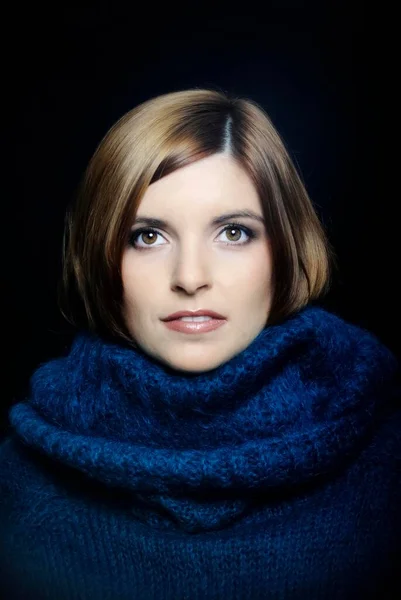 Young woman wearing a turtleneck sweater, portrait