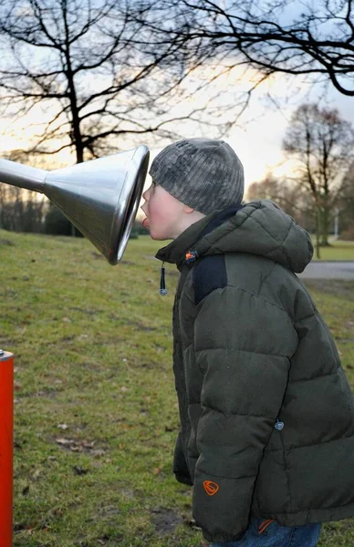 Little Boy Sticking His Head Funnel Intercom Playground — 스톡 사진