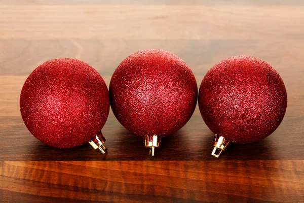 Red Christmas Tree Ornaments Wooden Table — Stock fotografie