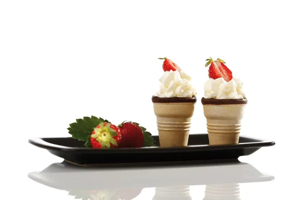 Two Wafer Cones Cream Strawberries Black Tray — Zdjęcie stockowe