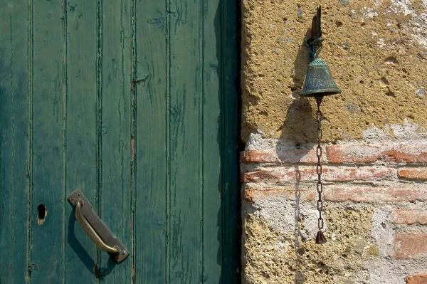Front door and bell in an old farmhouse, Tuscany, Italy, Europe