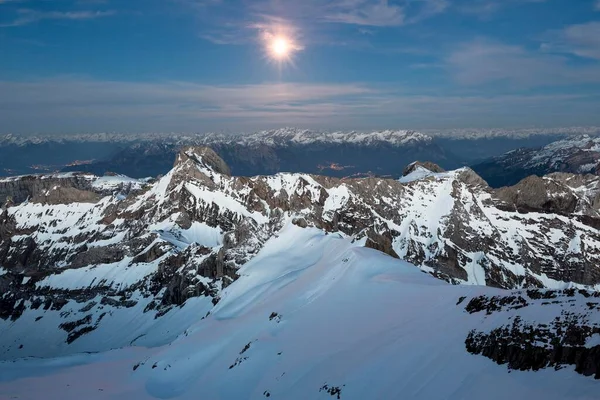 Sntis Mountain overlooking Alpstein massif at full moon, Appenzell Alps, Appenzell, Switzerland, Europe