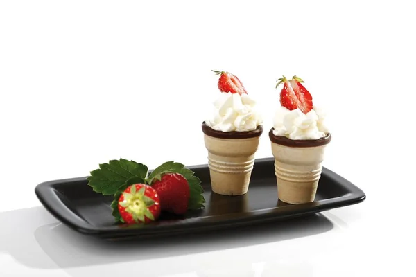 Two Wafer Cones Cream Strawberries Black Tray — Zdjęcie stockowe