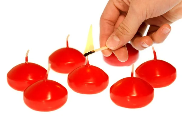 Lighting Red Candles — Stockfoto