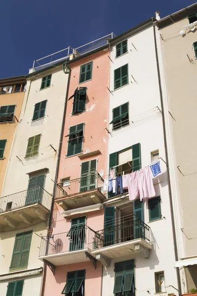 Building facades with clothes hung out to dry, Portovenere, La Spezia province, Italy, Europe