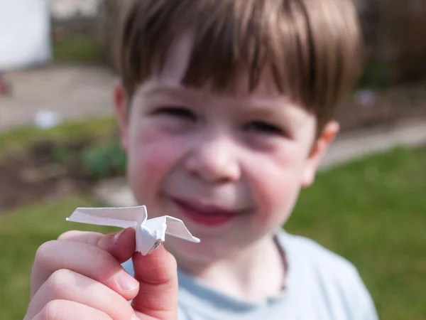 Child Holding Paper Airplane Garden Germany Europe — Stockfoto