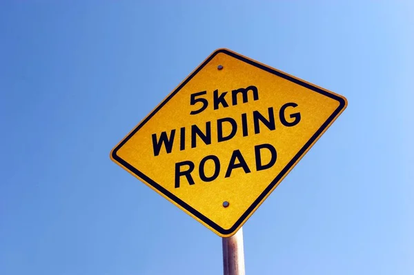 Sign Winding Road Close View — Φωτογραφία Αρχείου