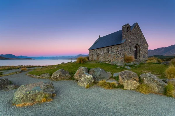Church of the Good Shepherd at Lake Tekapo at the blue hour, behind the Southern Alps, Lake Tekapo, Canterbury Region, New Zealand, Oceania