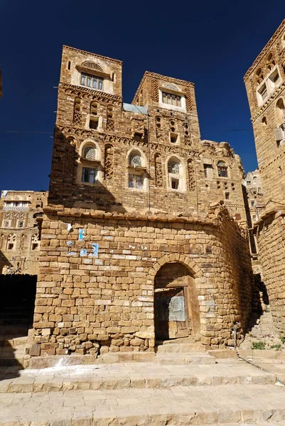 Decorated stone houses in the old town of Thula, Yemen, Asia