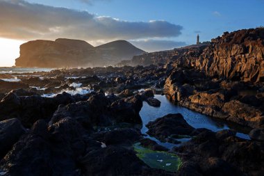 Sea lava rock, Volcanic landscape, Capelinhos volcano, Ponta dos Capelinhos, evening light, Capelo, Island of Faial, Azores, Portugal, Europe clipart