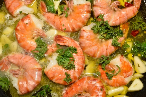 King prawns, tiger shrimps, with garlic and parsley in a pan, Canary Islands, Spain, Europe