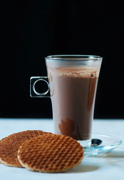 Hot cocoa in the glass with cookies — Stock Photo, Image