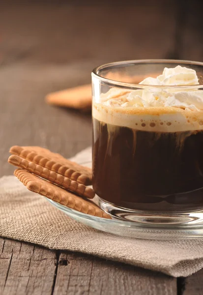 Creamy coffee in glass cup — Stock Photo, Image