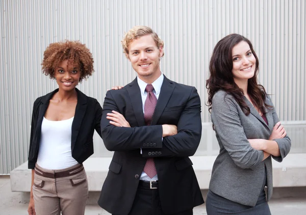 Attractive young business group standing together at office — Stock Photo, Image