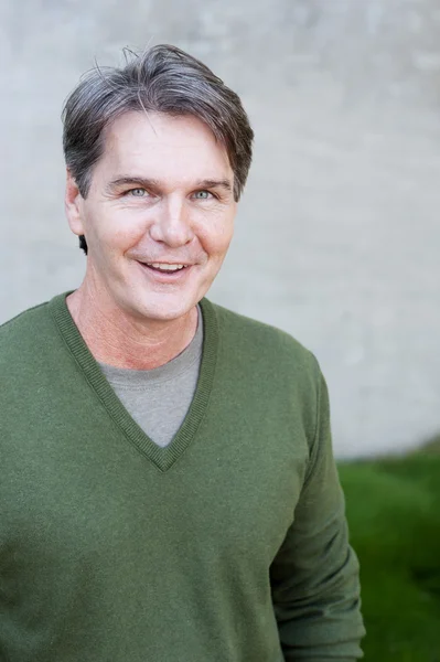 Portrait of mature man in a park — Stock Photo, Image