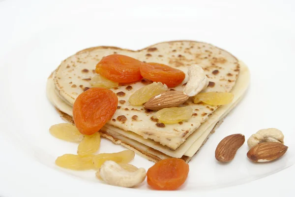 Heart-shaped pancake on white — Stock Photo, Image