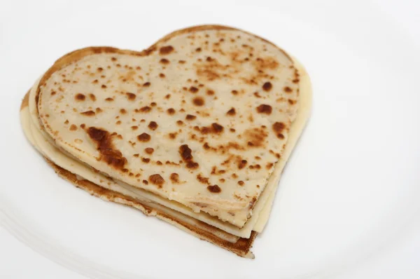 Heart-shaped pancakes on white — Stock Photo, Image