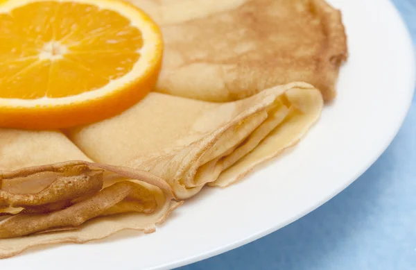 Pancake roll with orange — Stock Photo, Image