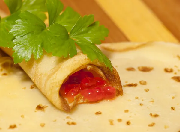 Pancake roll with red caviar — Stock Photo, Image