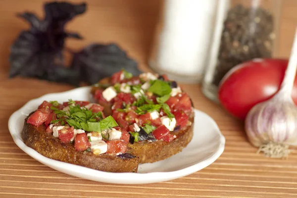 Italian Bruschetta with tomatoes and feta — Stock Photo, Image