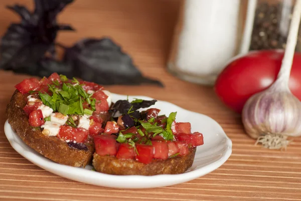 Italian Bruschetta with tomatoes and feta — Stock Photo, Image