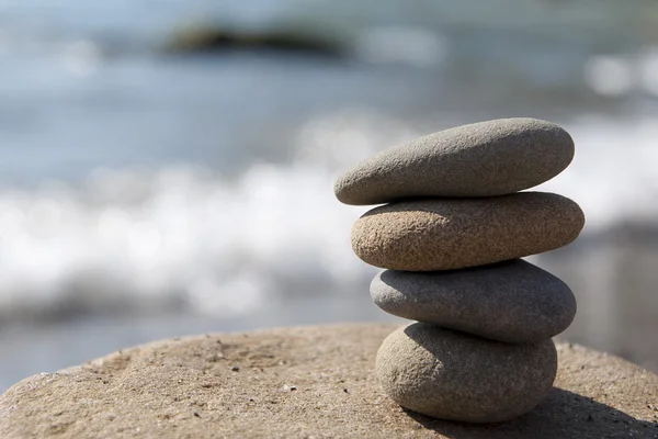 Balanced stones (pebbles) at seashore — Stock Photo, Image