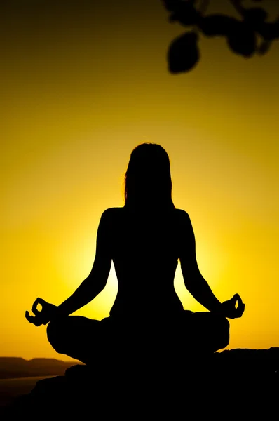 Yoga pose at sunrise, silhouette Stock Photo