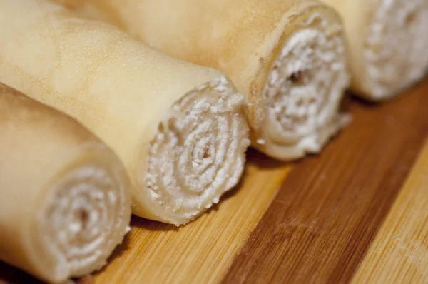 Pancake rolls with sweet cottage cheese — Stock Photo, Image