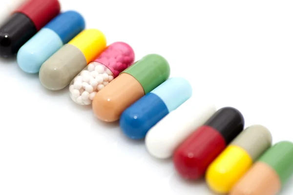 Various capsules in row — Stock Photo, Image